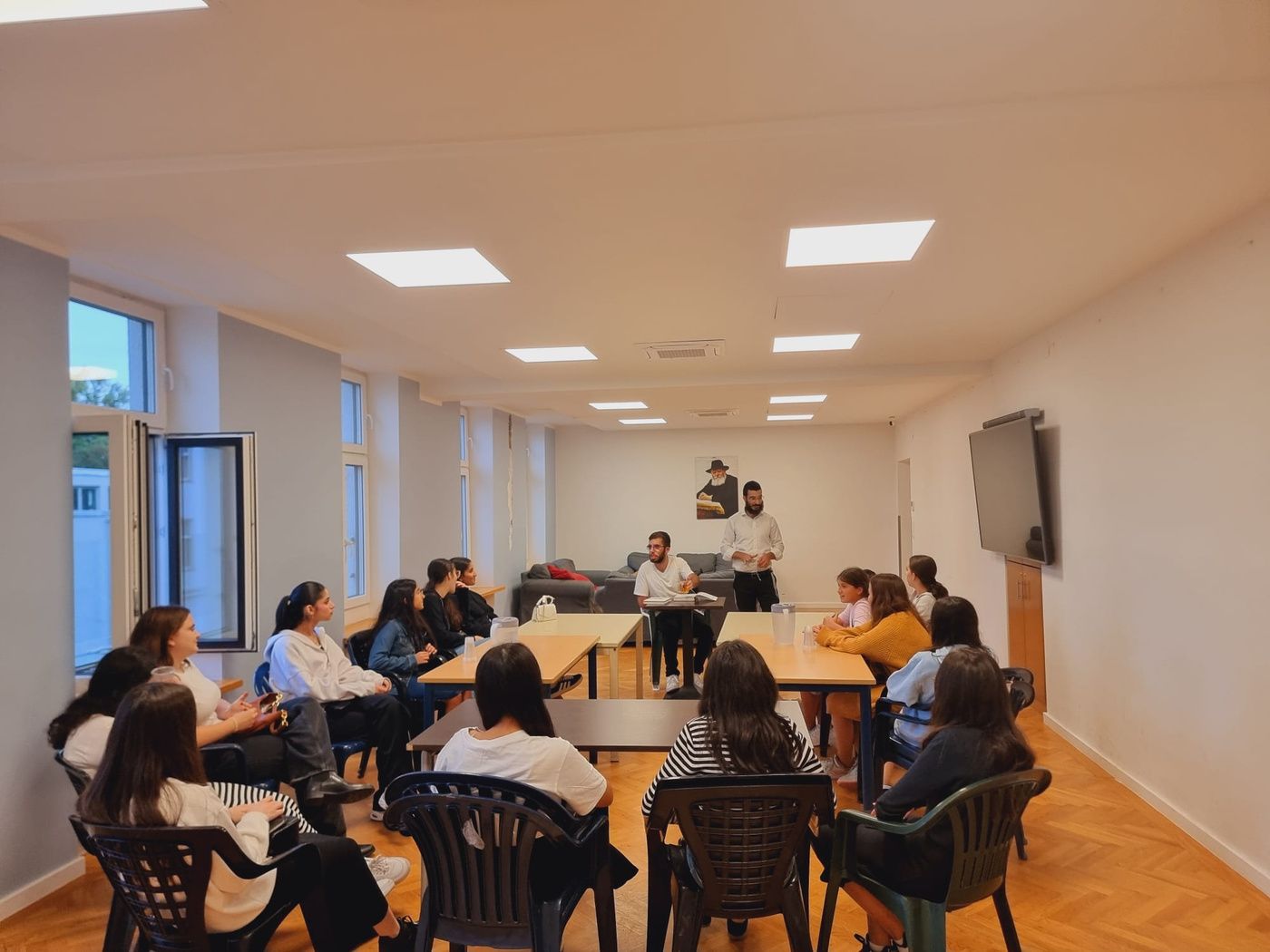 A Club Chai group session, participants seated together in discussion.